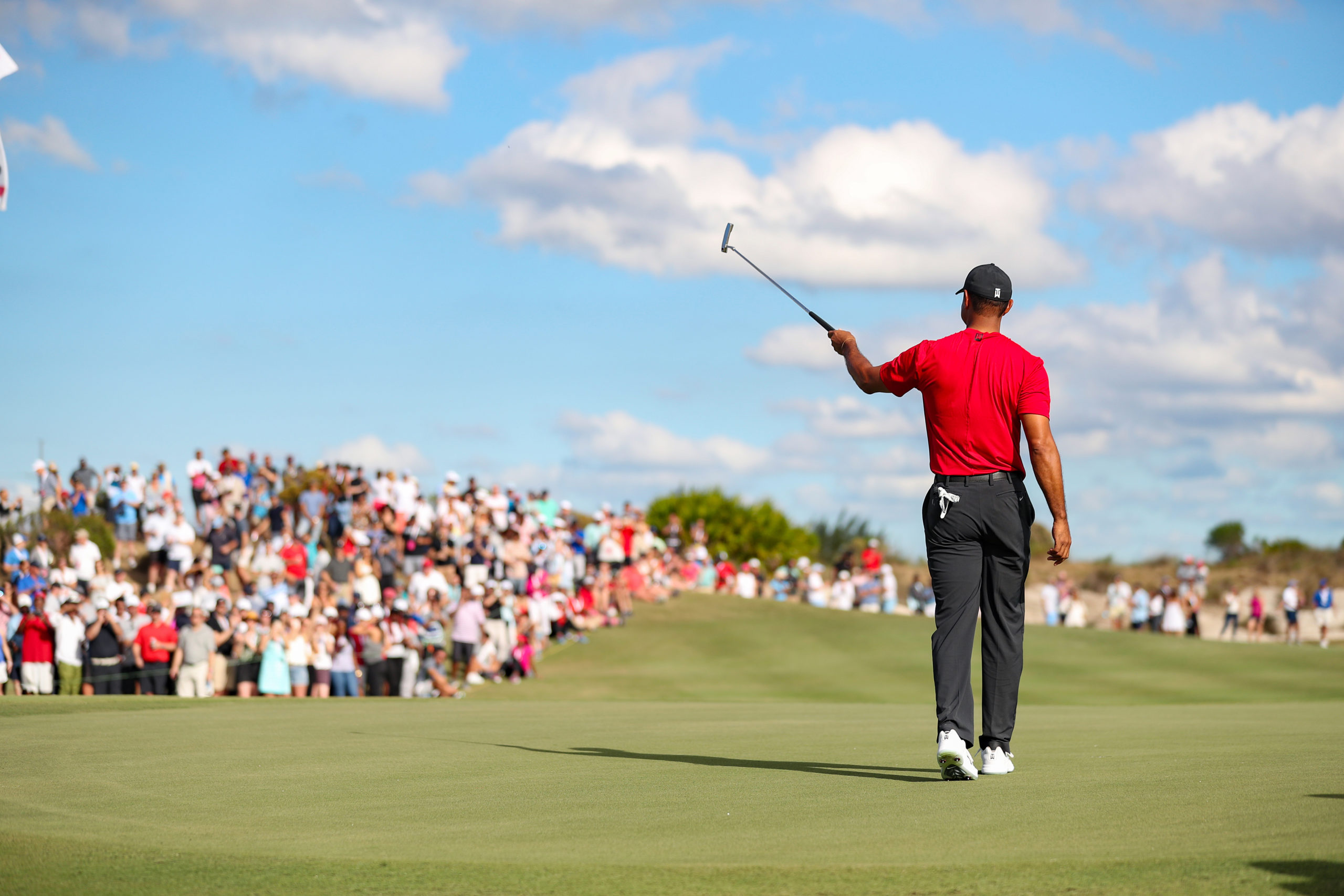 Tiger Woods signals to the crowd during the Hero World Challenge 2022 competition.